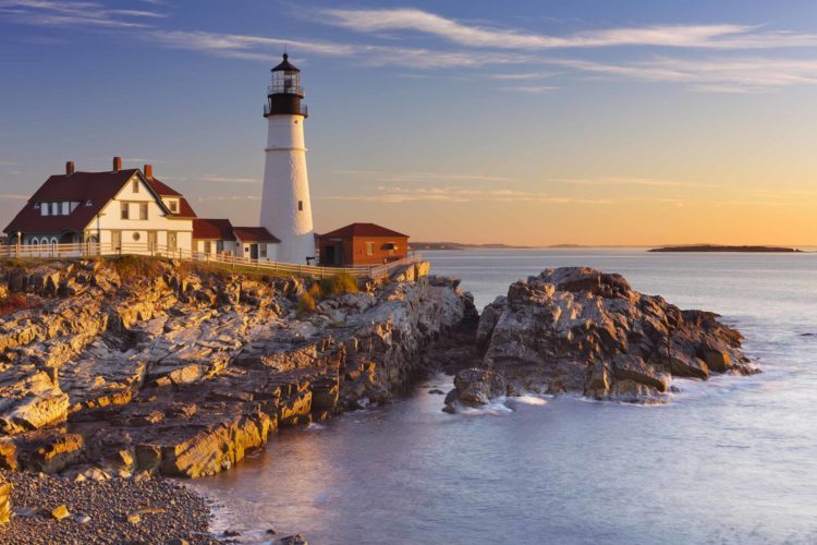 The Portland Head Lighthouse in Maine, USA at sunrise.